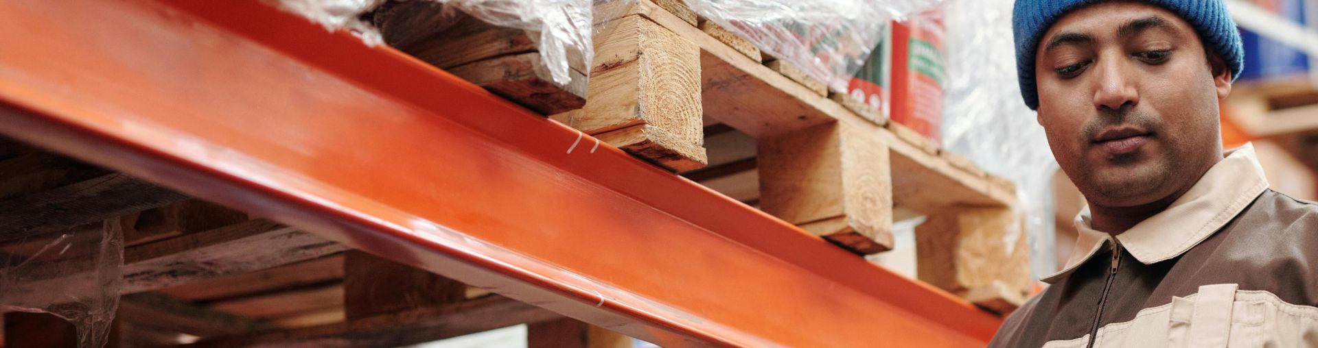 A warehouse employee scans items using a tablet, ensuring inventory accuracy.